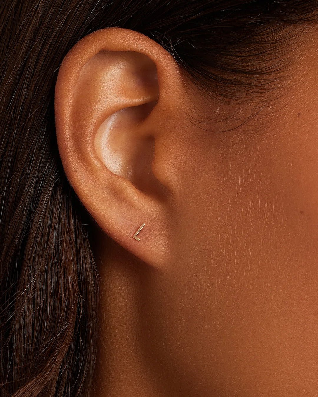 Woman wearing alphabet earring stud || option::14k Solid Gold, L, Single