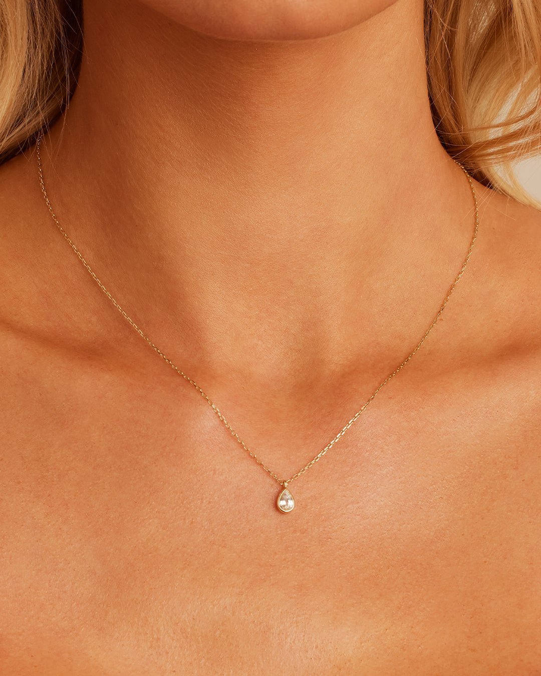 Woman wearing  White Sapphire Pear Charm Necklace || option::14k Solid Gold